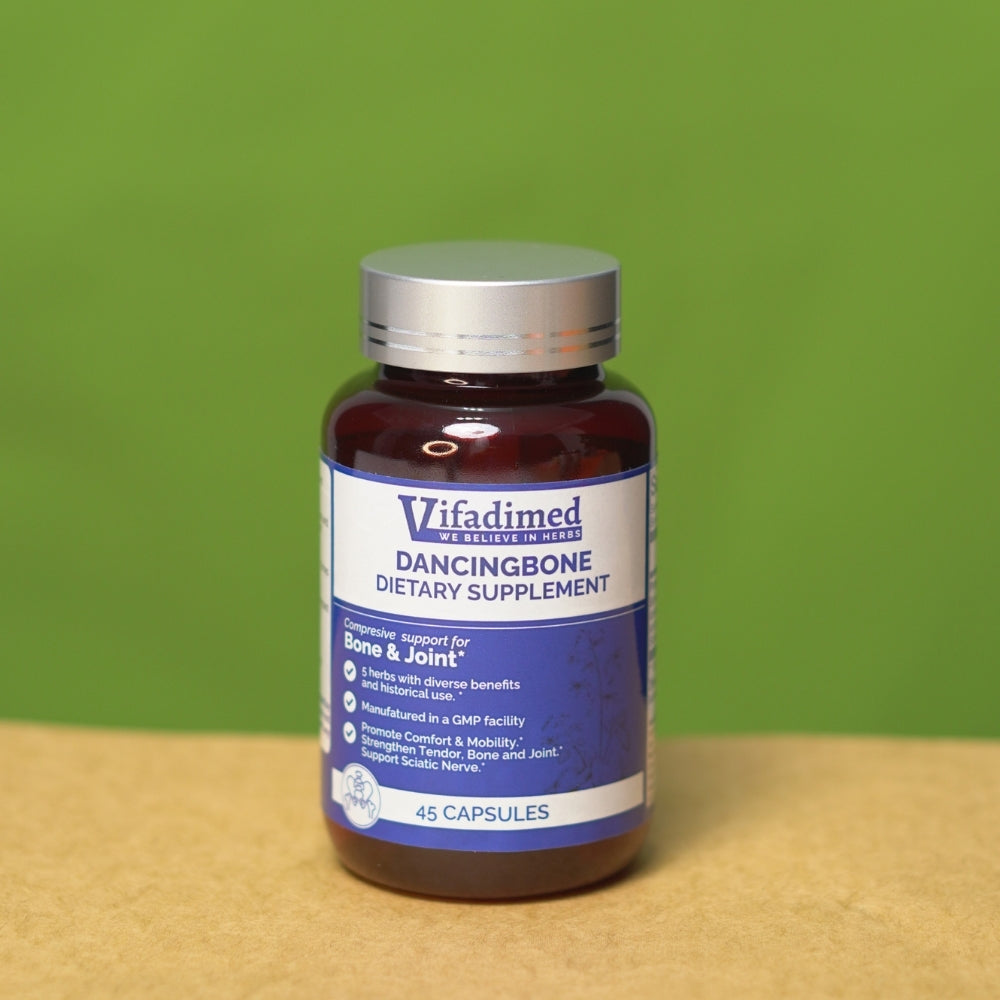 Vifadimed Dancingbone dietary supplement bottle on a wooden surface with a green background